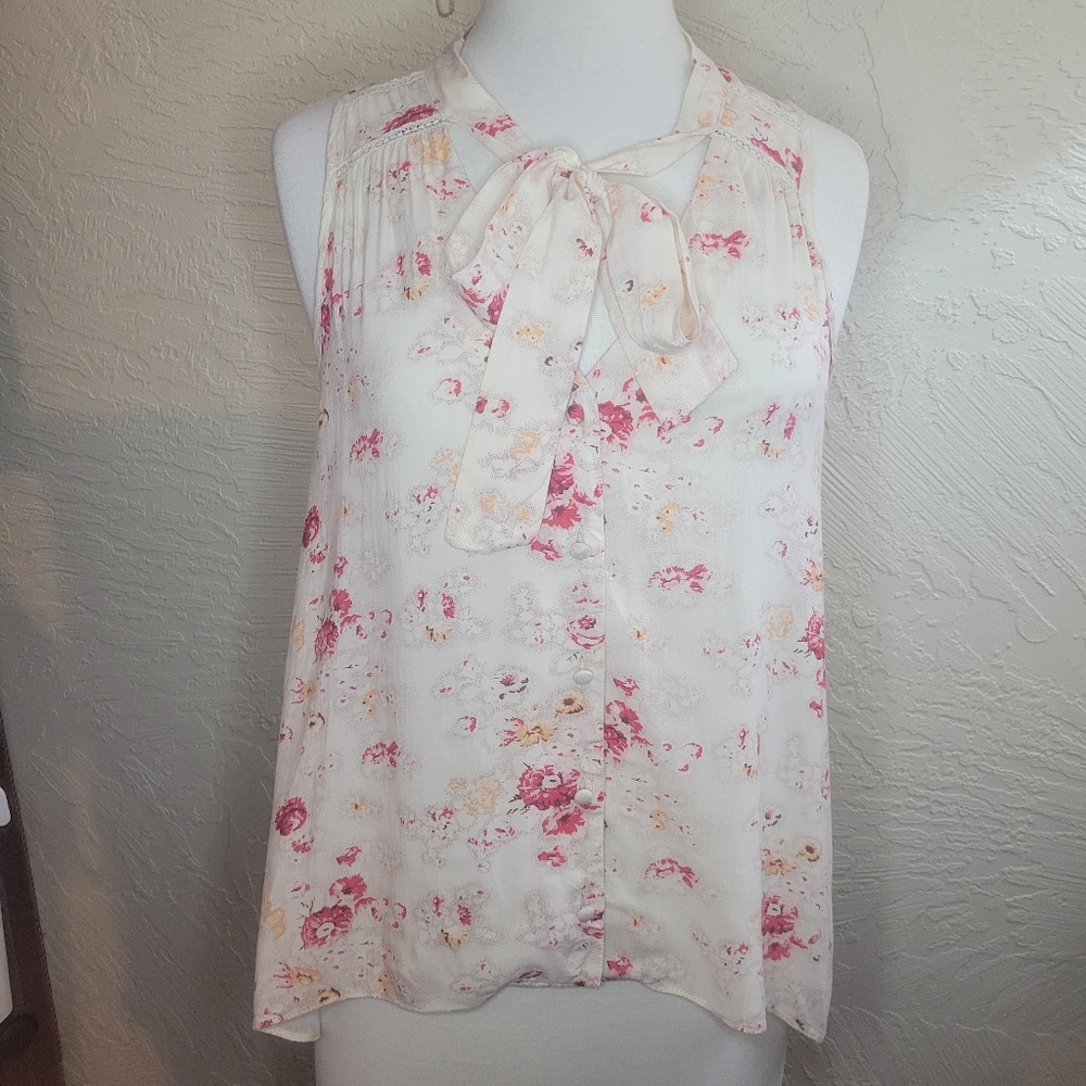 Free people sleeveless button down high low blouse.